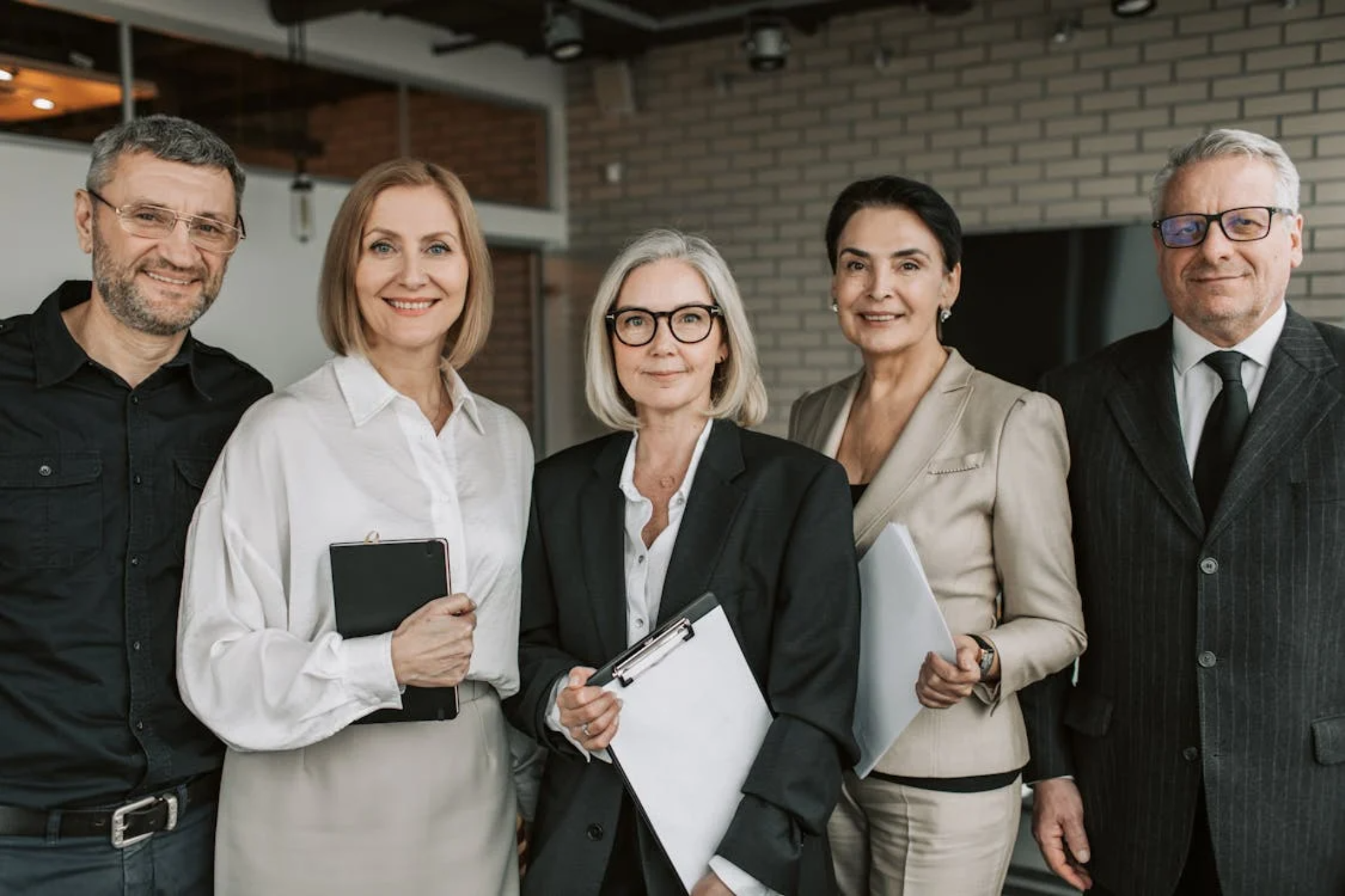 HOA board or management team members posing with documents.