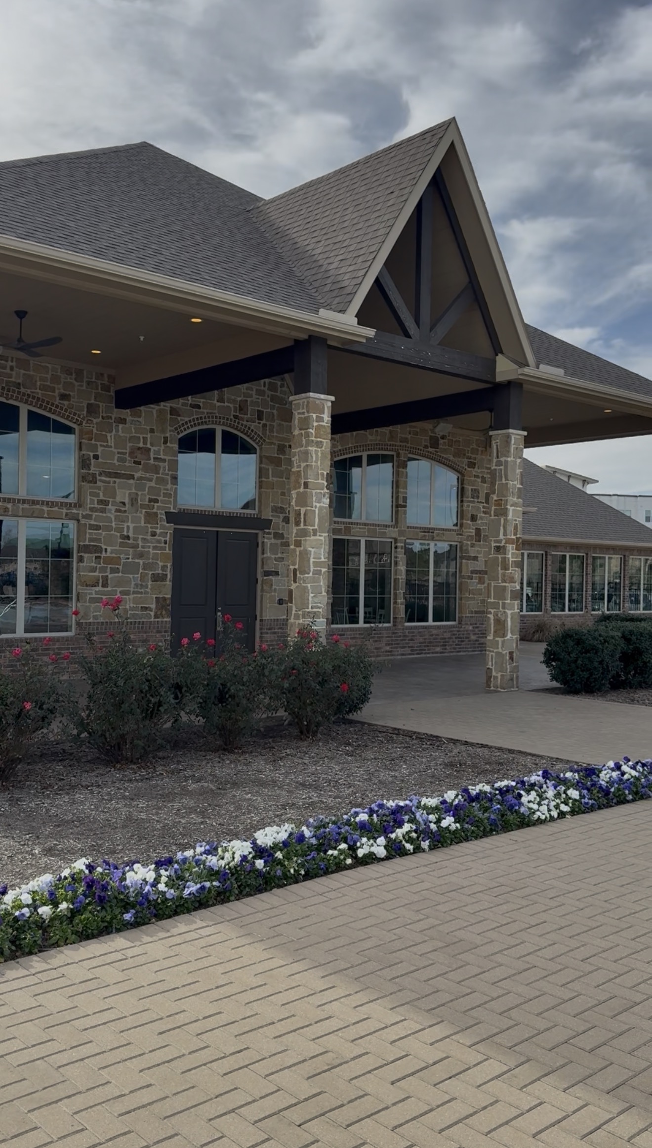Mercer Residential West clubhouse entrance with upgraded landscaping and walkway improvements