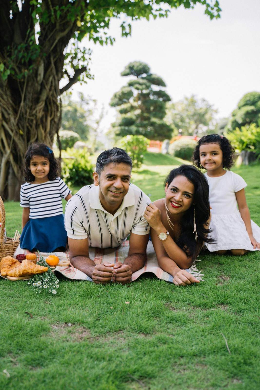 Family enjoying time together in a landscaped neighborhood park within a Denver residential community.