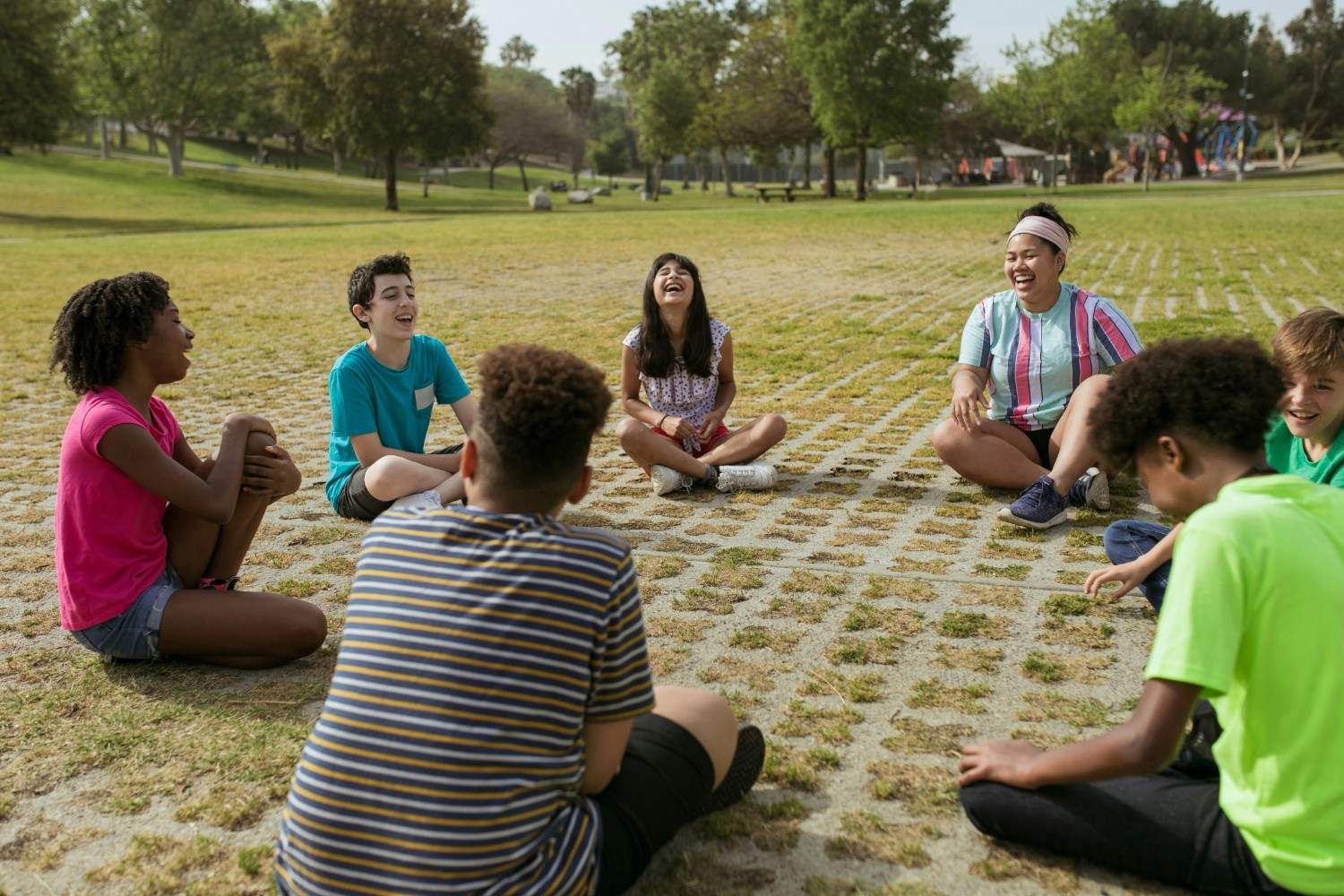 Children and families enjoying outdoor recreation in a community park.