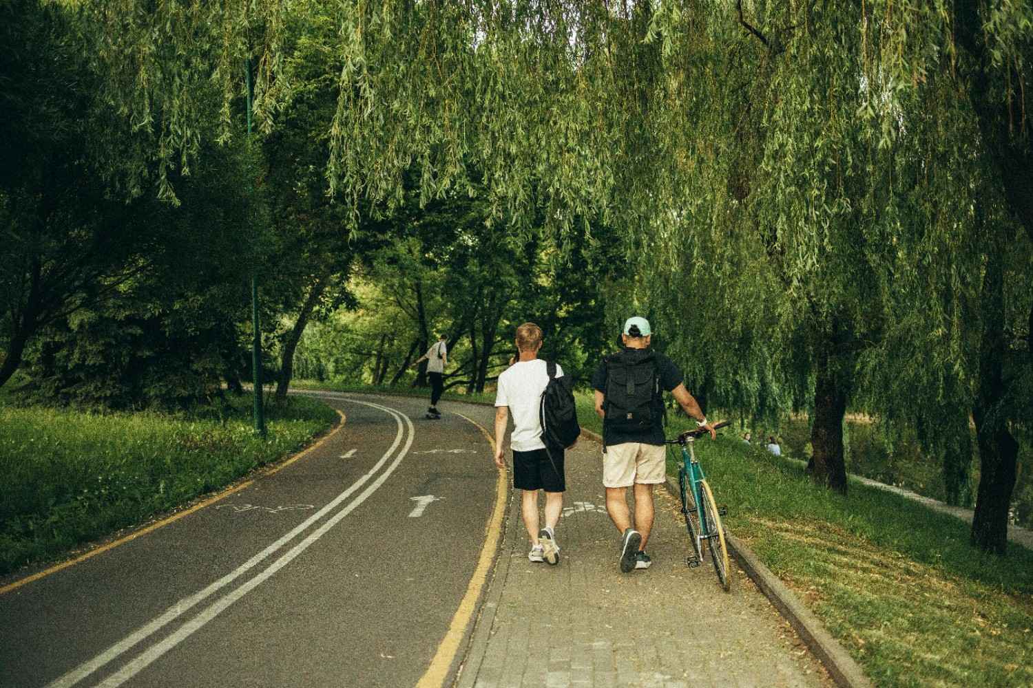 Residents enjoying a tree-lined community path in Plano.